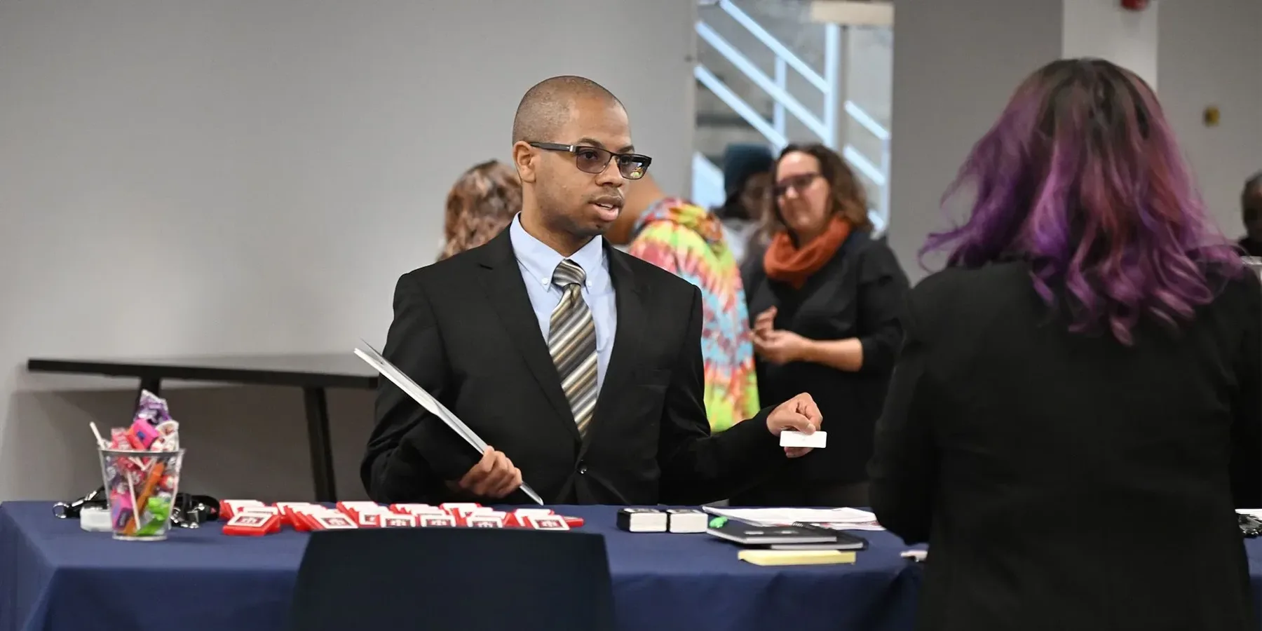 Man visiting booth at Mosaic Center job fair
