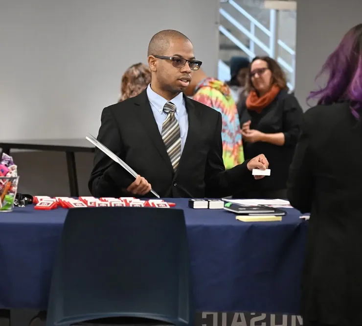 Man visiting booth at Mosaic Center job fair